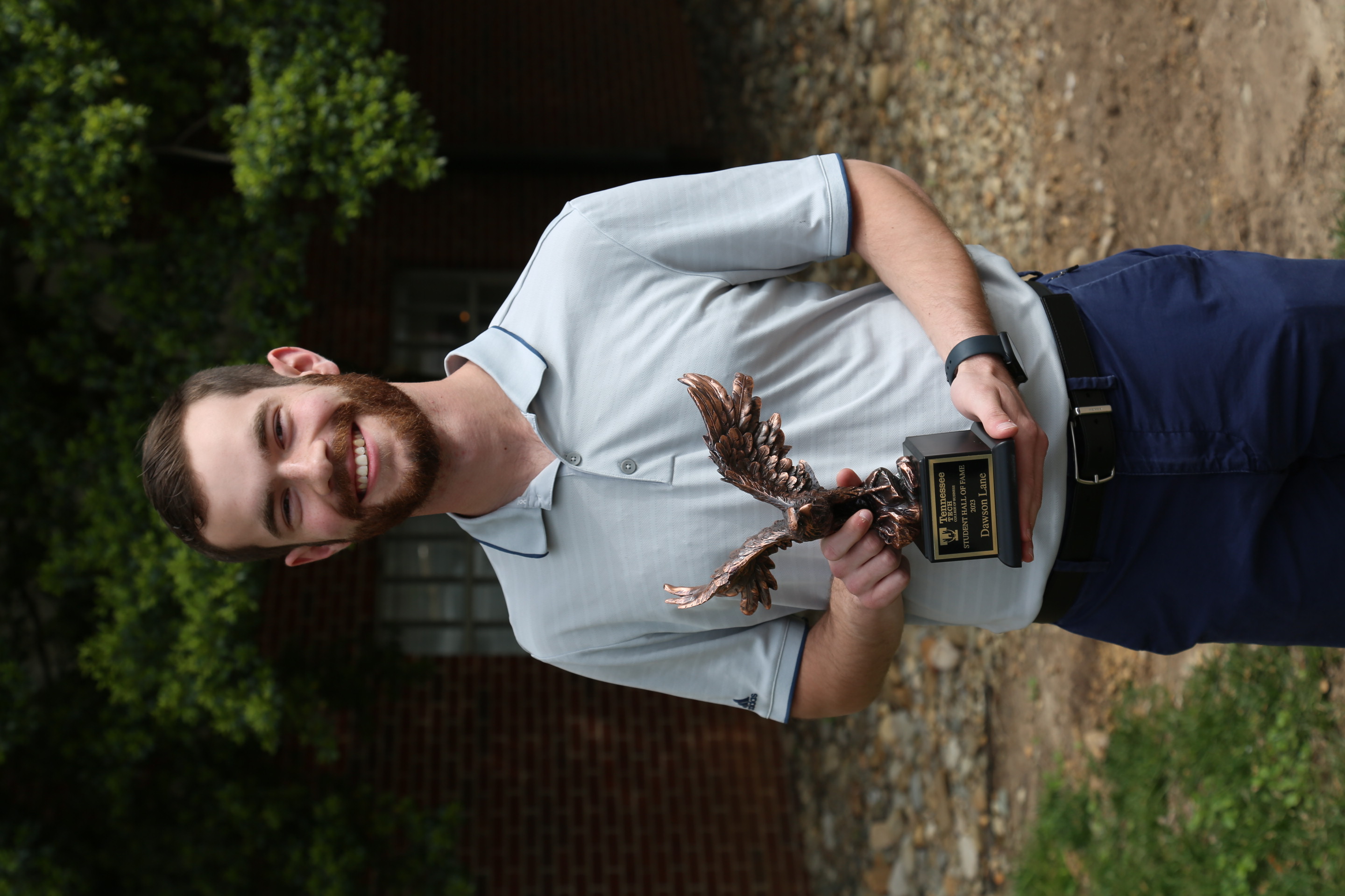 Dawson Lane with the Hall of Fame award.