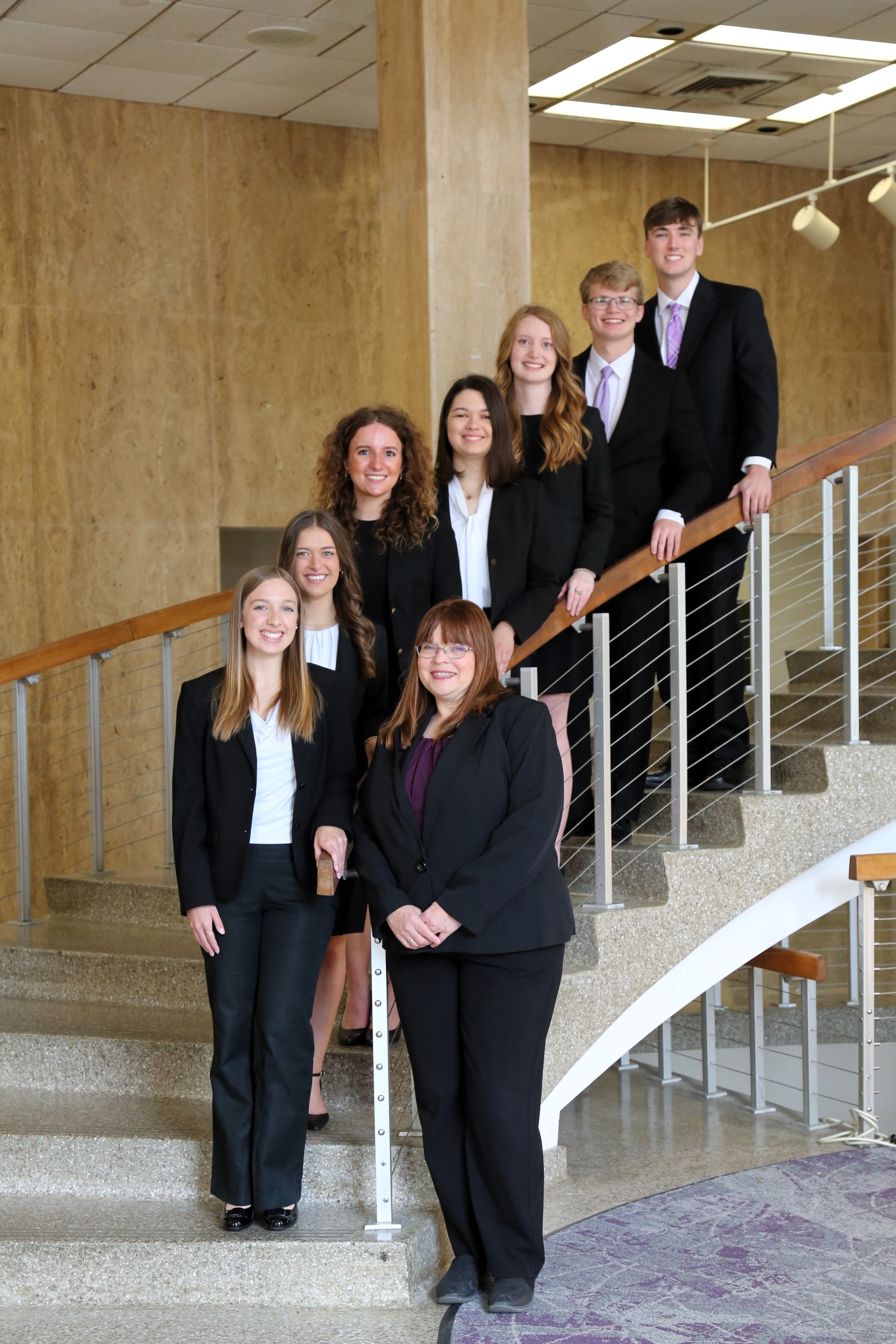 Professional Readiness and Leadership Team in front of a door.