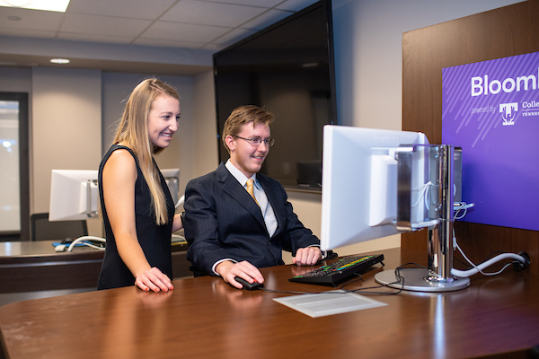 students around a computer