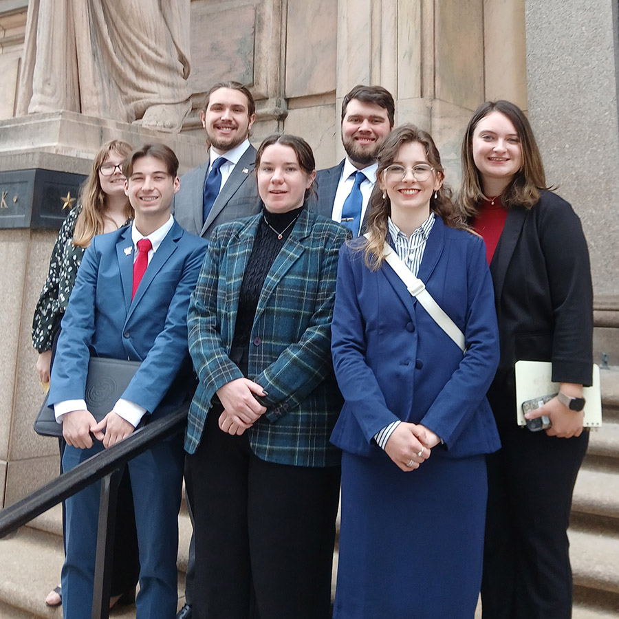 The Omicron Delta Epsilon group on a trip to the Federal Reserve.