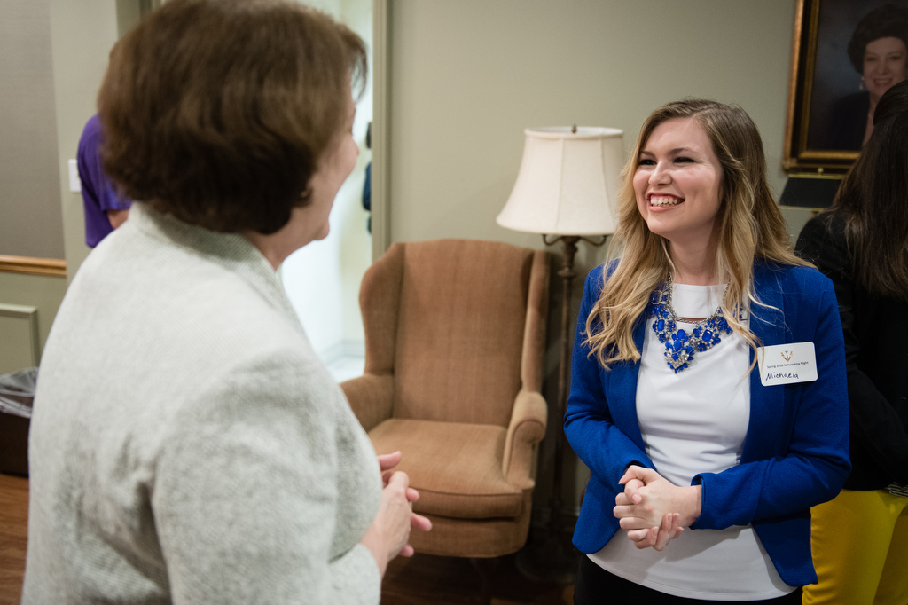 Student speaking at a networking event