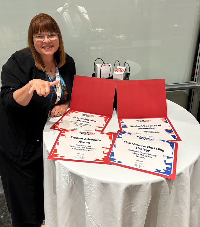 Sherrie Cannon with the student advocate award, student speaker of distinction award, outstanding new program award, and most creative marketing strategy award