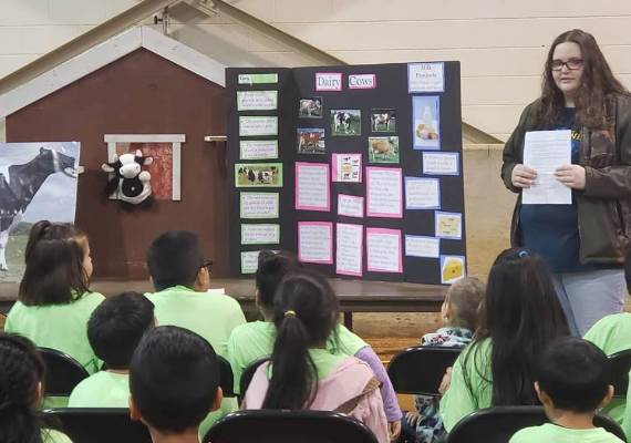 A student teaches at Farm Day event