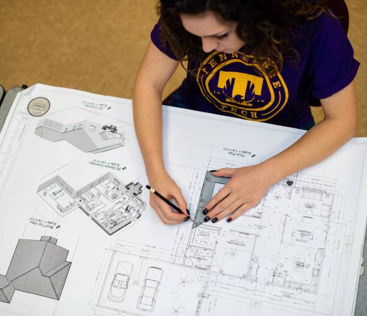 Student working on housing layout