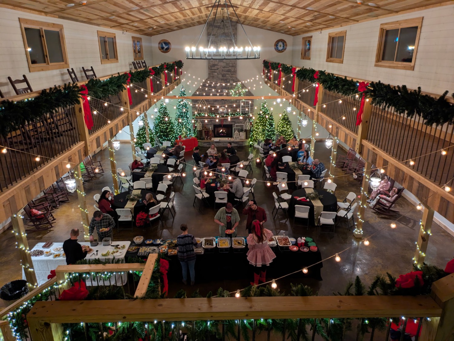 people celebrating at a holiday party, taken from above on a balcony 