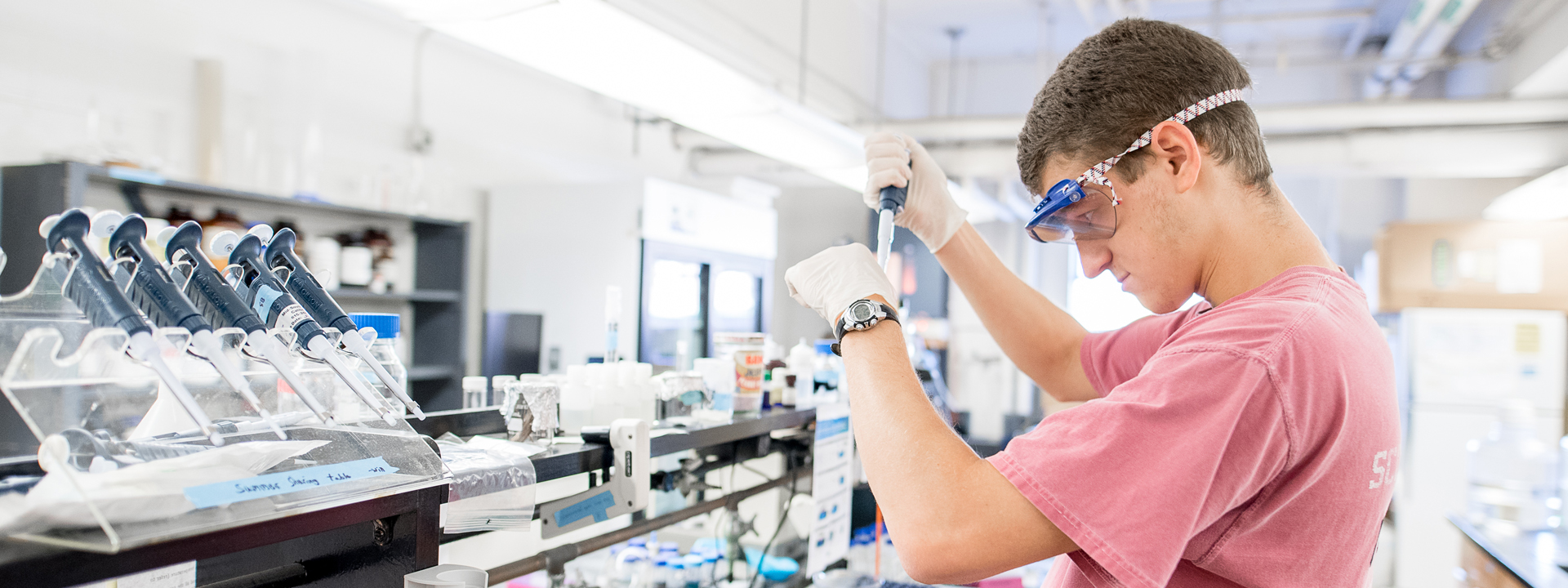 Nathan, a student, working in a Chemistry lab.