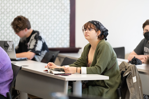 Student seated in classroom