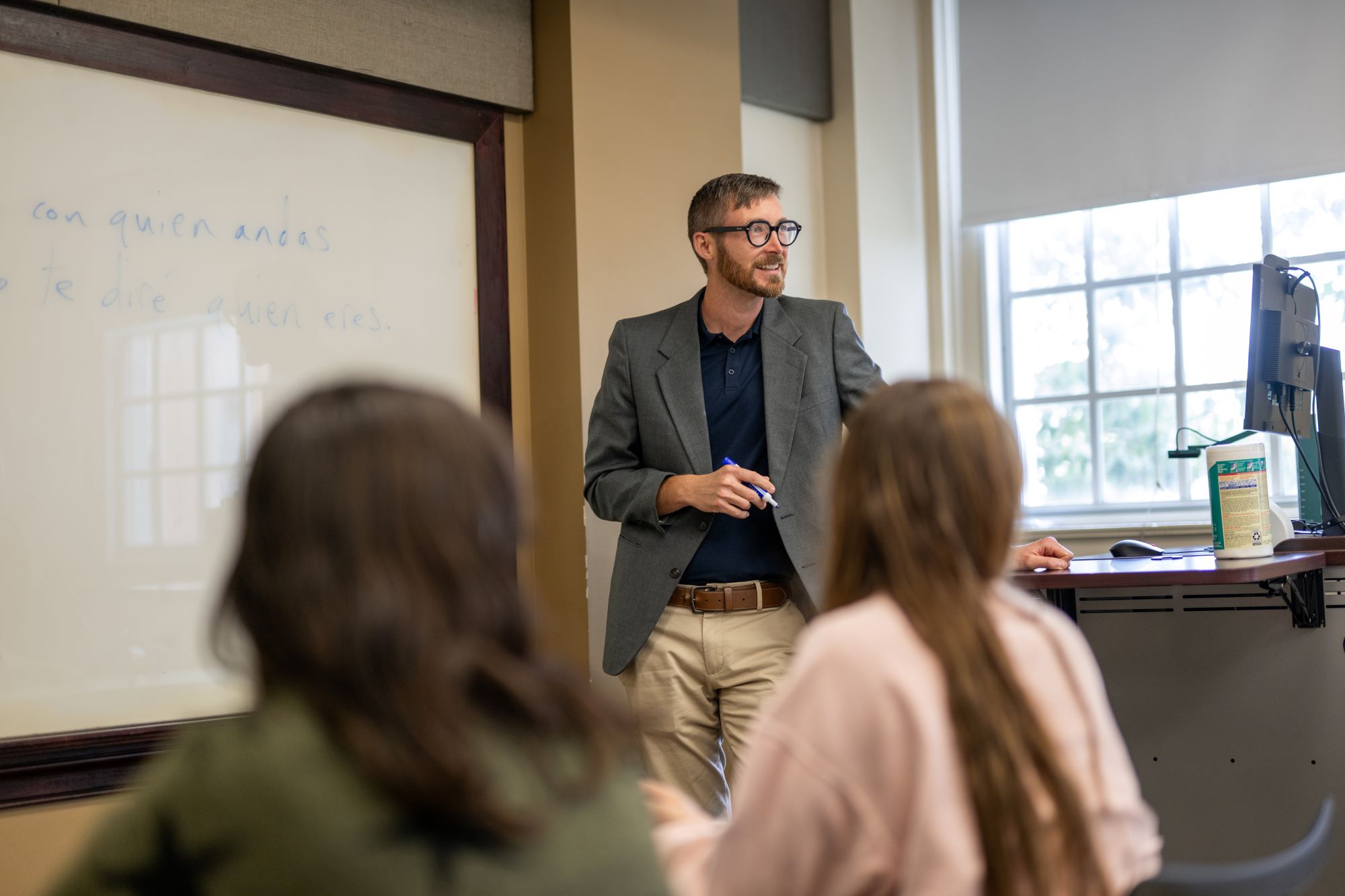 Dr. Martin teaching in front of a whiteboard