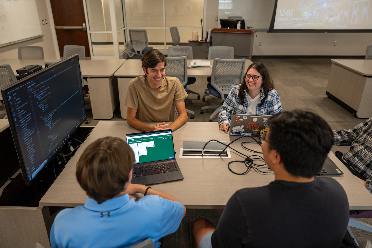 students studying on laptops