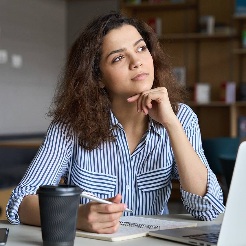 person sitting with computer thinking
