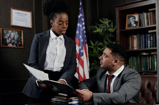 Environmental Law Photo showing two officials in an office