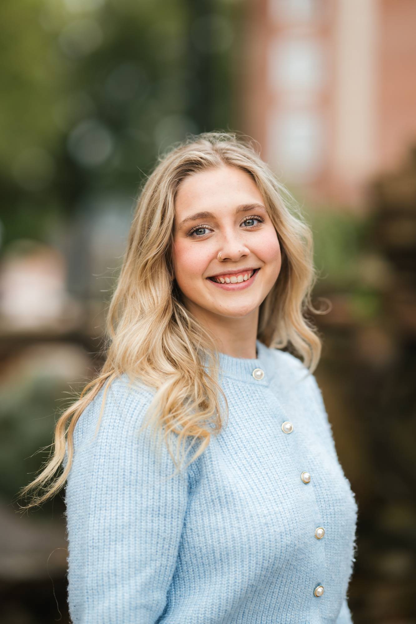Selah in a blue sweater smiling