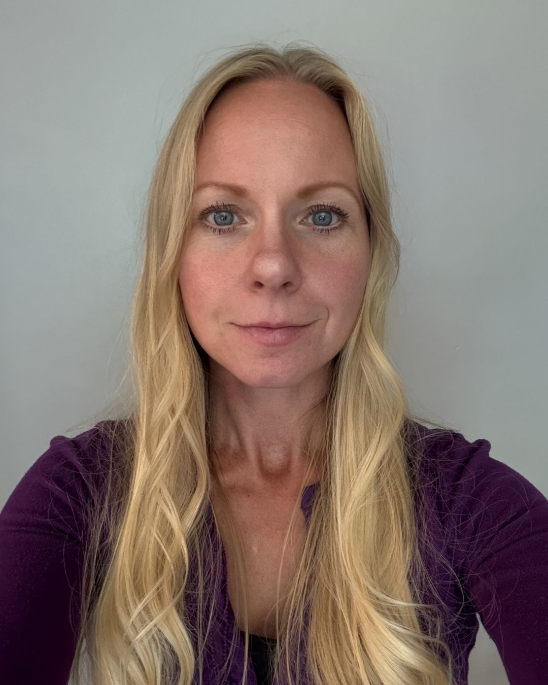 a blonde woman smiling