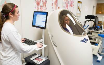 Students experience the BodPod - health assessment technology.
