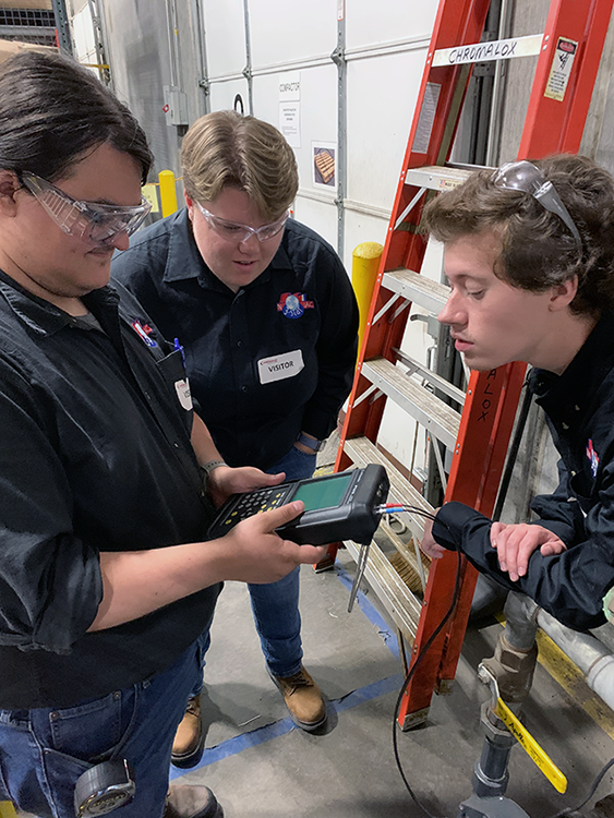 IAC students checking testing results