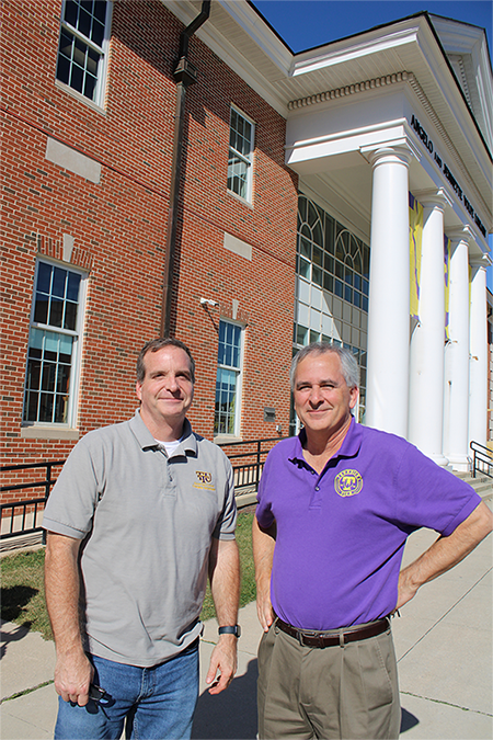 Professors Talbert and Eberle stand in front of the MInDS center.