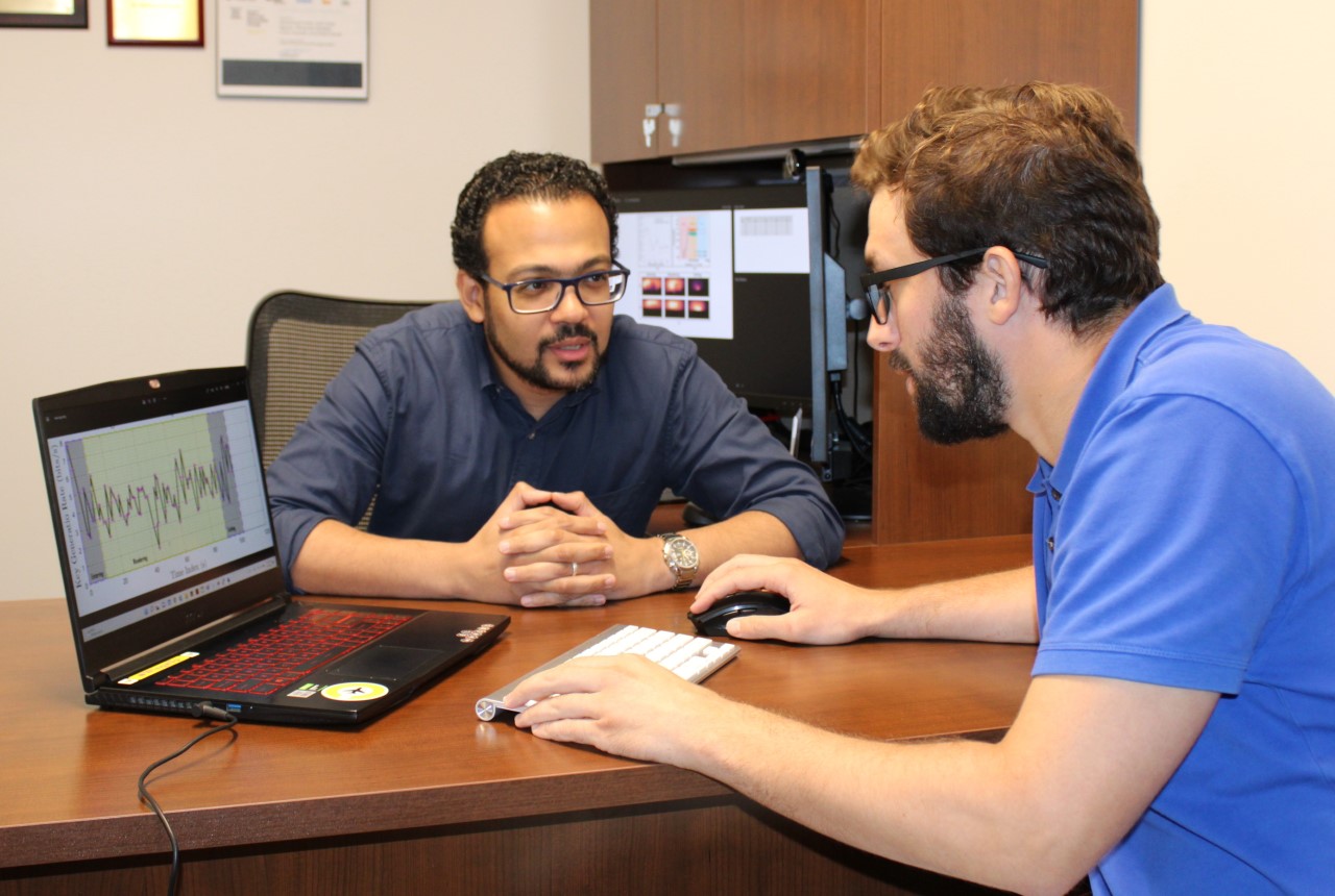 Professor assisting a student project.