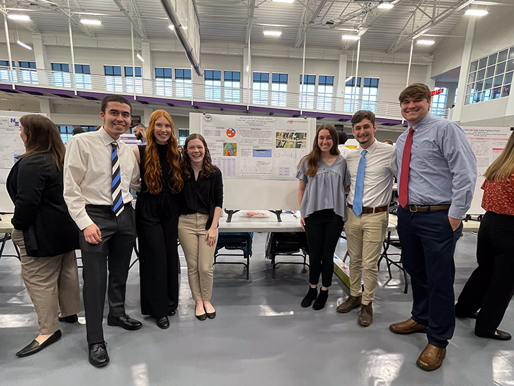 Students posing with their project