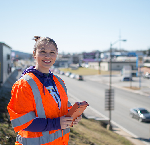 Civil engineering student working in the field