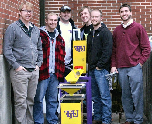 Students standing with their project