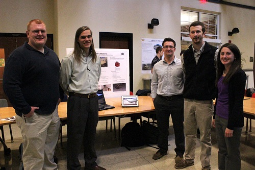 Students standing with their project