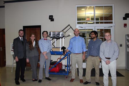 Students standing with their project