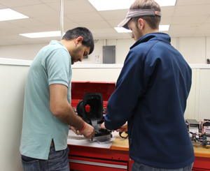 Students standing with their projects