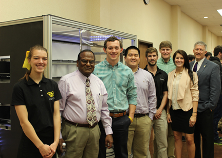 Students standing with their project