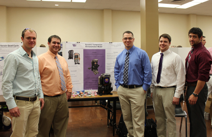 Students standing with their projects