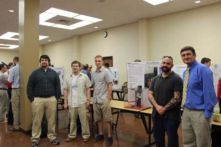 Students standing with their project