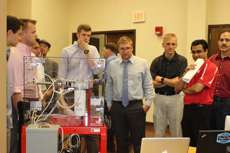 Students standing with their project