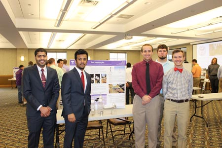 Students standing with their project