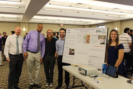 Students standing with their project