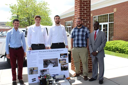 Students standing with their project