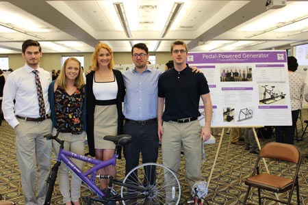 Students standing with their project