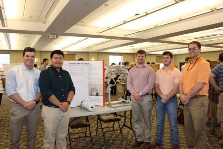 Students standing with their project