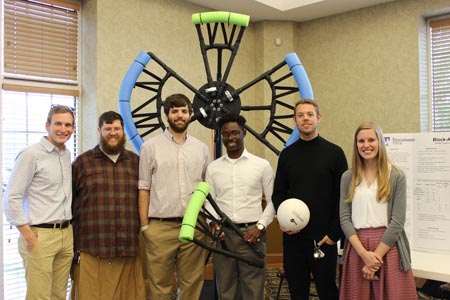 Students standing with their project