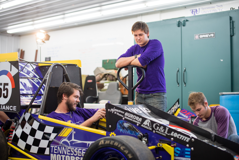 Students in a race car