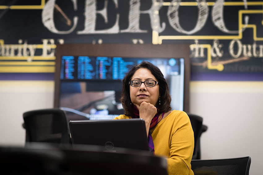 Ambareen Siraj sitting at a table in the CEROC lab