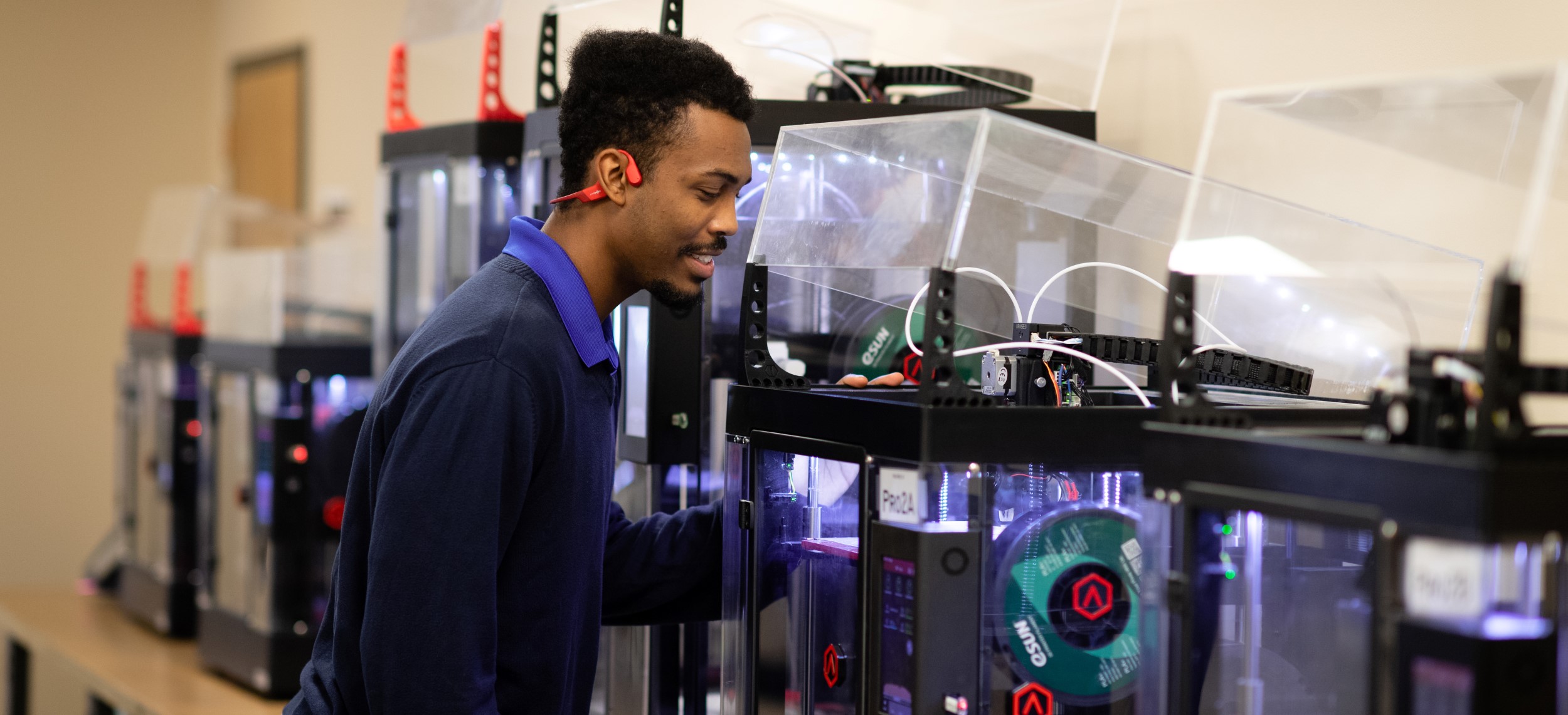 Student inspecting machinery