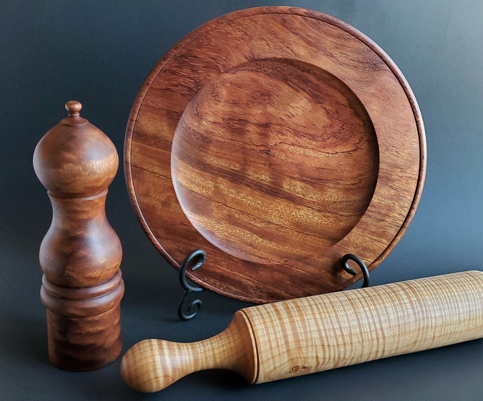 various woodturned items like a plate and rolling pin