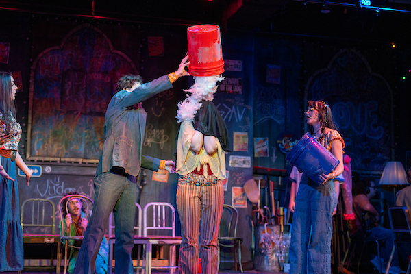 Godspell, Lamar dumping white feathers on Joanne