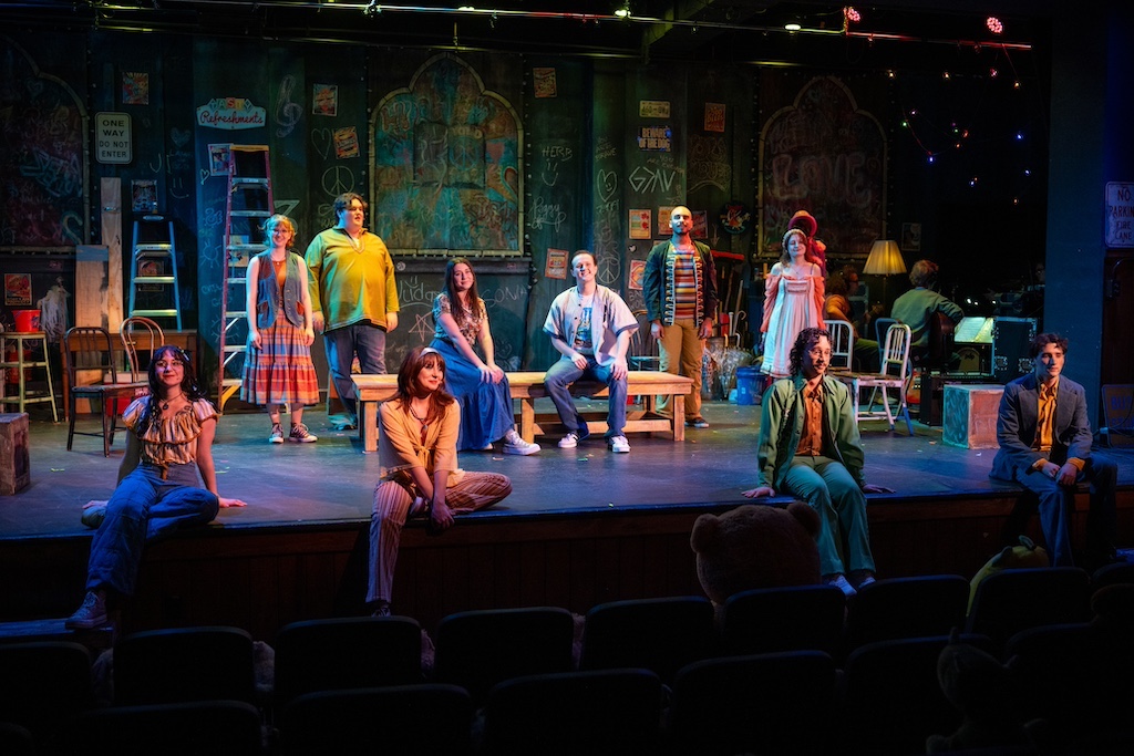 Godspell, entire cast sitting and standing on stage