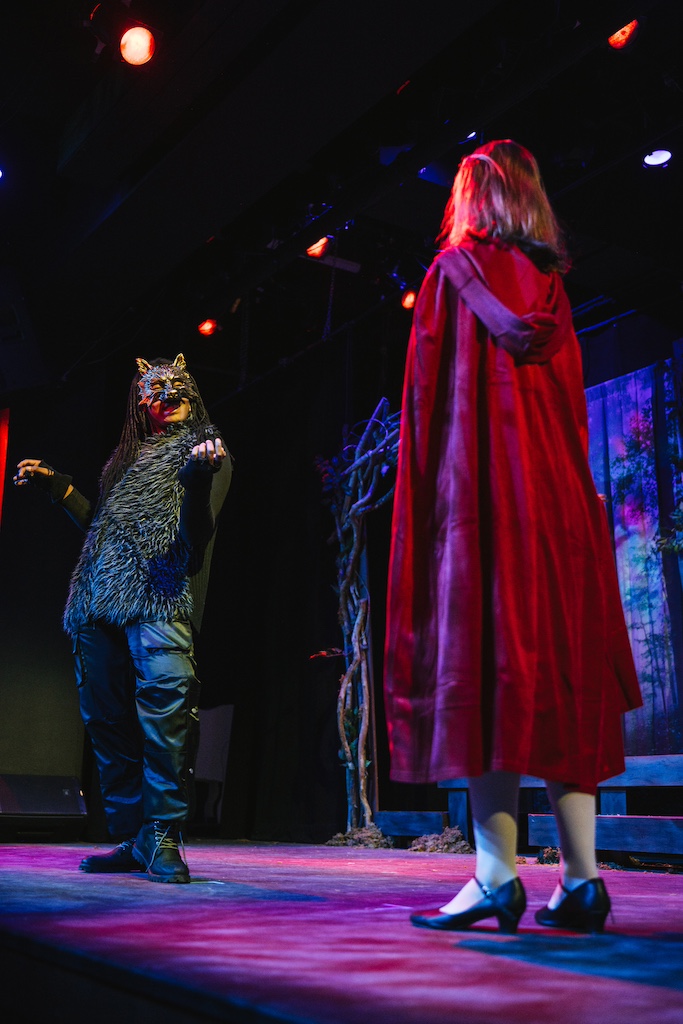 Into the woods, Wolf, played by Julian Cannon and Little Red Riding Hood 