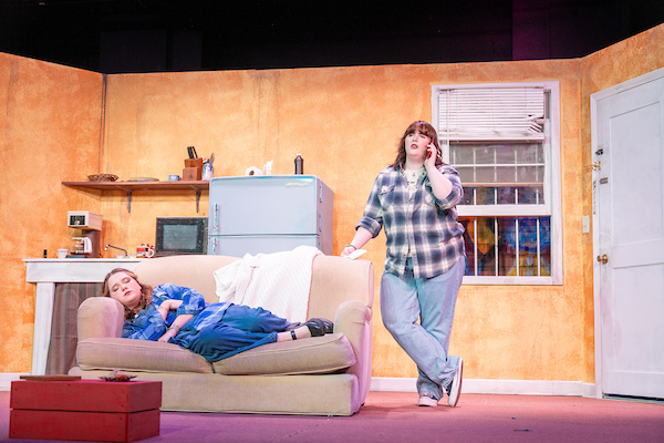 Somebody Nobody play: Sheena sleeping on a couch, Lolli on the phone