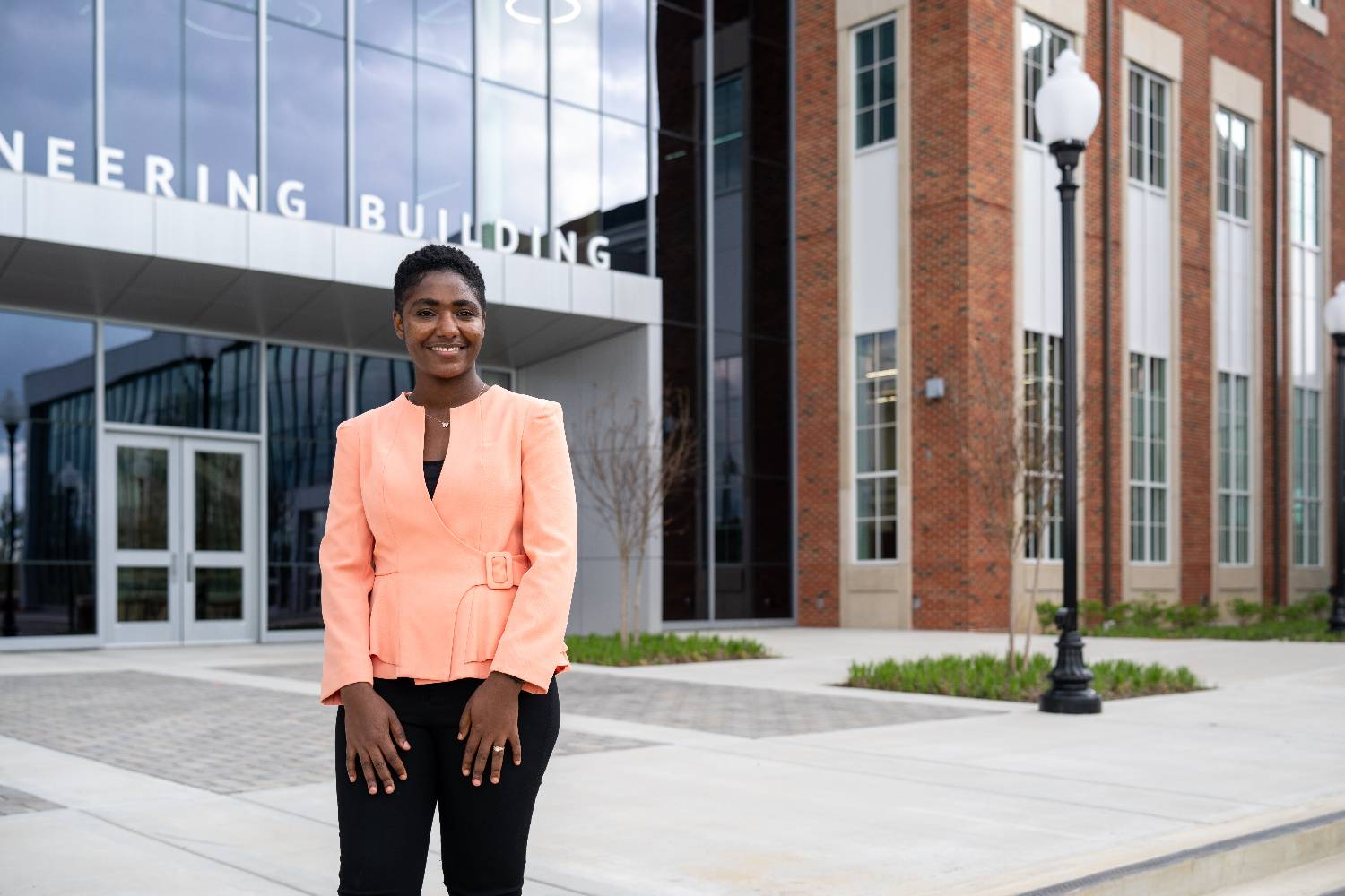 woman standing in front of AIEB smiling