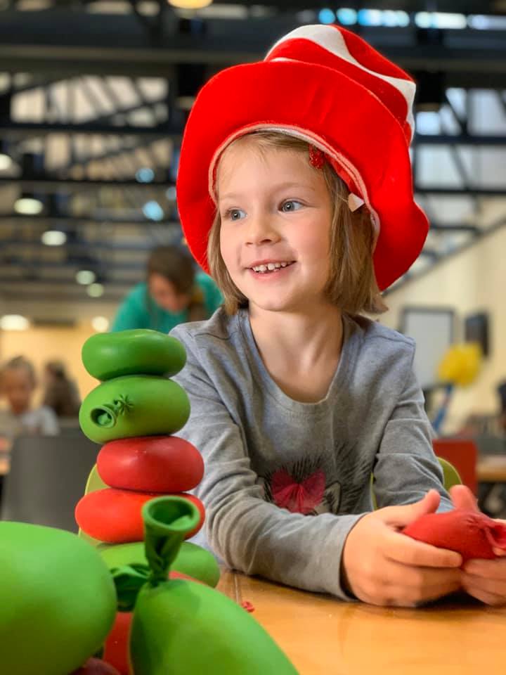 Girl smiling after building STEM activity