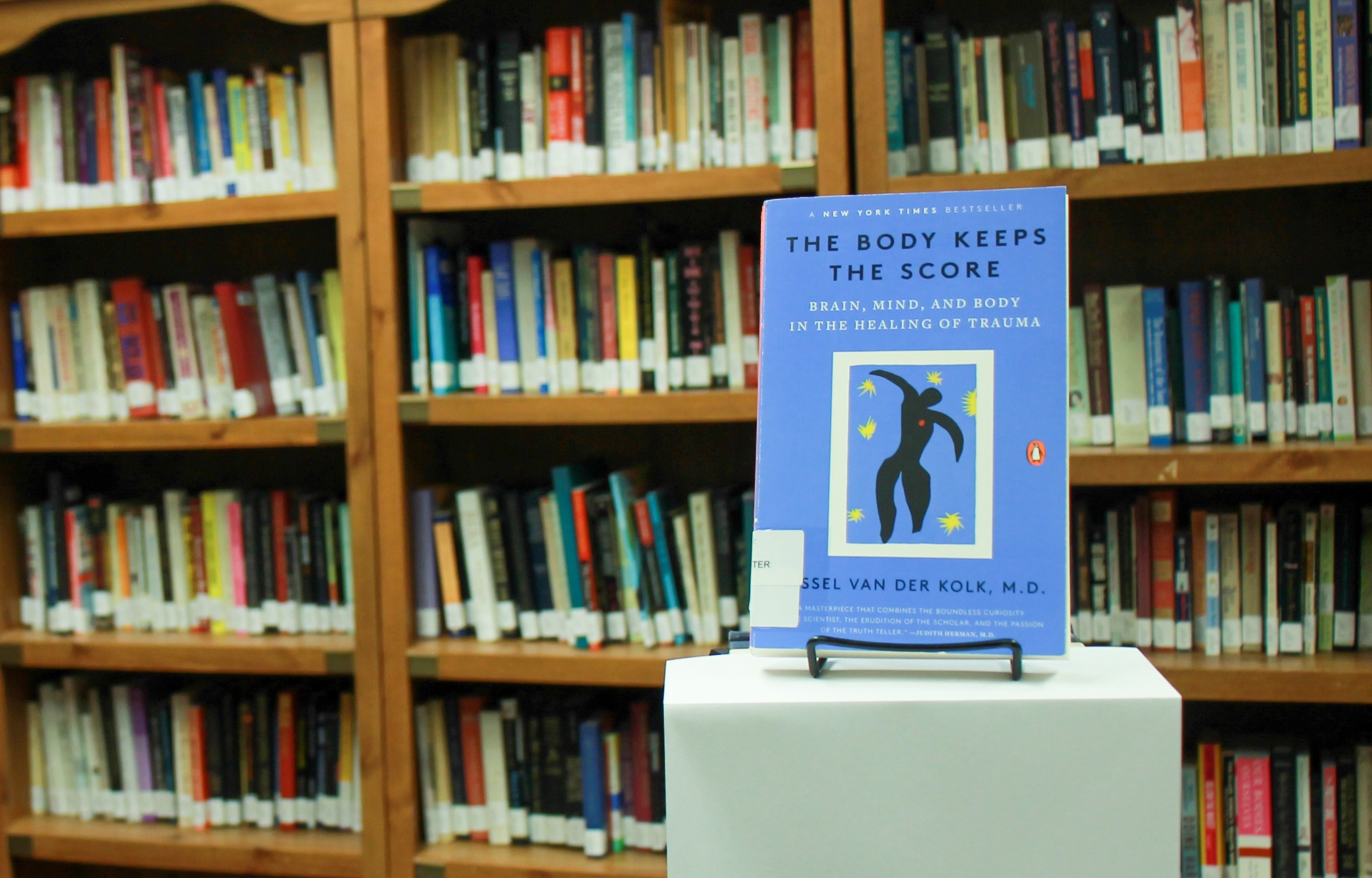 Our library in the background with the body keeps the score in the foreground