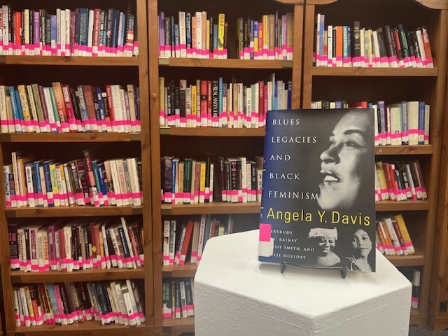 Book titled Blue Legacies and Black Feminism with woman's face on cover