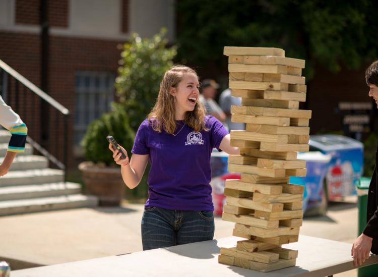 Student playing Jenga